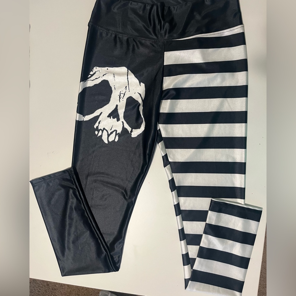 Stripped and skeleton design, share lightweight leggings. Small.